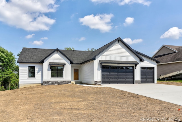 6322 Sheldon Dr, Hudsonville, MI 49426 - modern farmhouse style home with driveway, a garage, board and batten siding, and a shingled roof