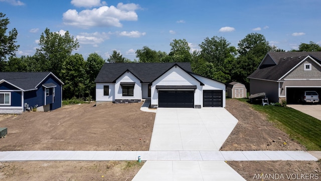 6322 Sheldon Dr, Hudsonville, MI 49426 - modern farmhouse style home with concrete driveway, an attached garage, and a storage unit