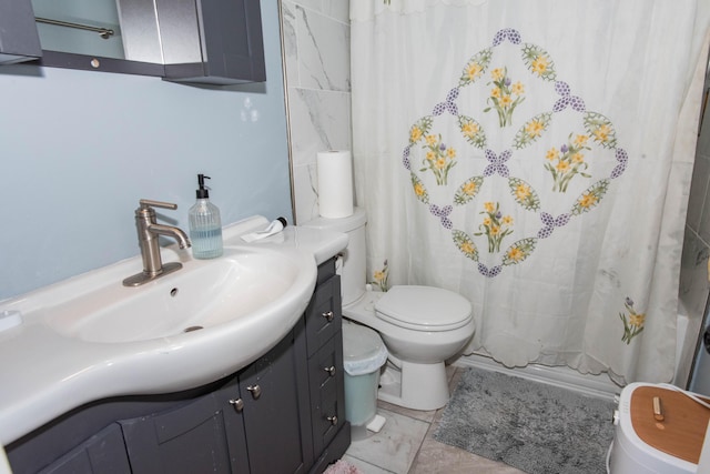 724 Garland Cir Unit D, Kalamazoo, MI 49008 - bathroom featuring vanity and shower / bath combo with shower curtain
