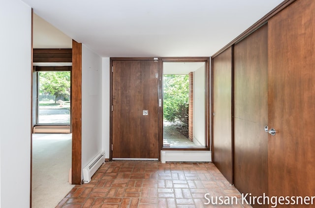 1129 Idema Dr SE, Grand Rapids, MI 49506 - entrance foyer with baseboard heating and brick flooring