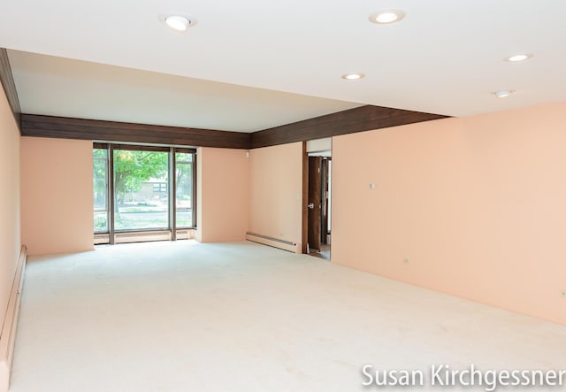1129 Idema Dr SE, Grand Rapids, MI 49506 - empty room with a baseboard radiator, light colored carpet, and recessed lighting