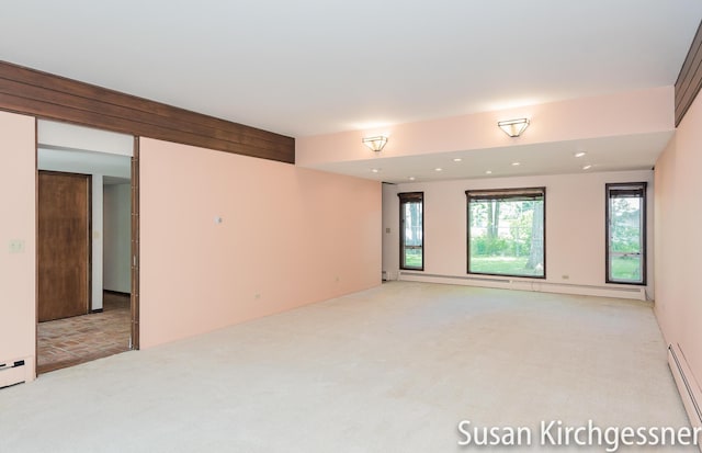 1129 Idema Dr SE, Grand Rapids, MI 49506 - empty room with light colored carpet, baseboard heating, and recessed lighting