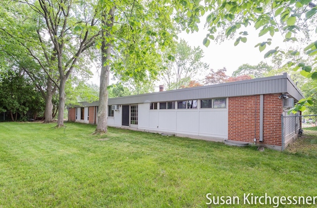 1129 Idema Dr SE, Grand Rapids, MI 49506 - rear view of house with brick siding