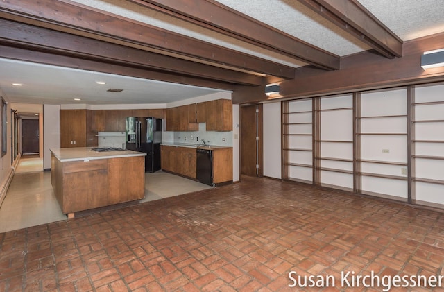 1129 Idema Dr SE, Grand Rapids, MI 49506 - kitchen featuring black appliances, light countertops, brown cabinets, brick patterned flooring, and beamed ceiling