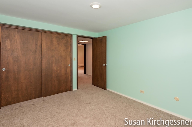 1129 Idema Dr SE, Grand Rapids, MI 49506 - unfurnished bedroom featuring carpet and a closet