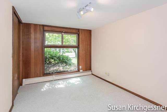 1129 Idema Dr SE, Grand Rapids, MI 49506 - carpeted empty room with a baseboard radiator and baseboards
