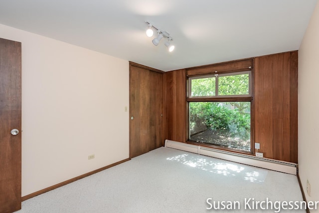 1129 Idema Dr SE, Grand Rapids, MI 49506 - carpeted empty room with a baseboard radiator and baseboards
