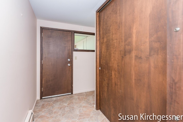1129 Idema Dr SE, Grand Rapids, MI 49506 - doorway to outside featuring baseboards and baseboard heating
