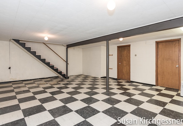 1129 Idema Dr SE, Grand Rapids, MI 49506 - finished basement with stairway and tile patterned floors