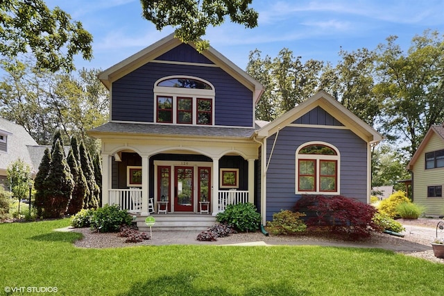 120 S Kenzie St, New Buffalo, MI 49117 - view of front facade with covered porch and a front lawn