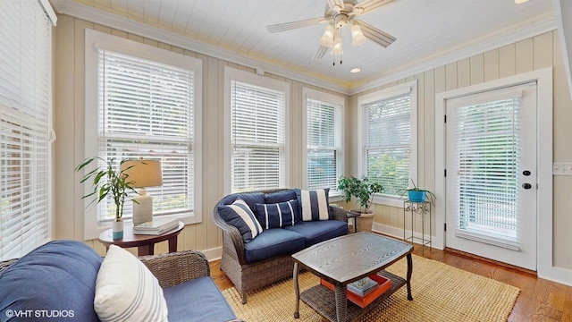 120 S Kenzie St, New Buffalo, MI 49117 - living area featuring ornamental molding, a ceiling fan, and light wood-style flooring