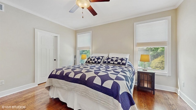 120 S Kenzie St, New Buffalo, MI 49117 - bedroom with wood finished floors, crown molding, and ceiling fan