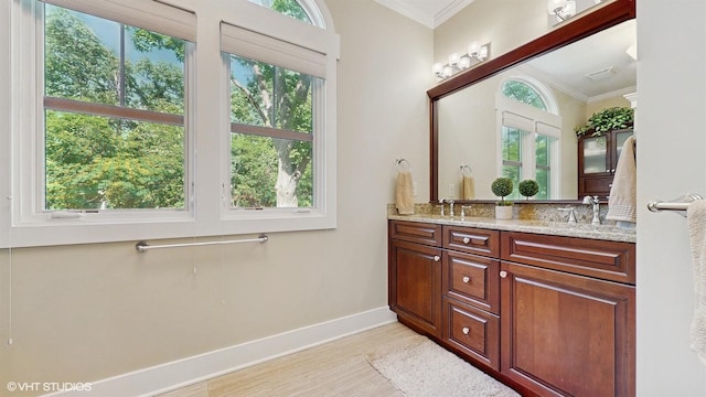 120 S Kenzie St, New Buffalo, MI 49117 - bathroom with double vanity, ornamental molding, and wood finished floors