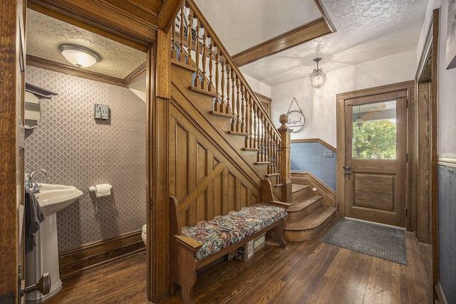73640 Fulton St, Armada, MI 48005 - entrance foyer featuring a wainscoted wall, dark wood-style flooring, stairway, wallpapered walls, and a textured ceiling