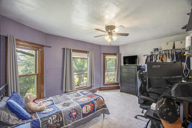 73640 Fulton St, Armada, MI 48005 - carpeted bedroom featuring a desk, a textured ceiling, and a ceiling fan
