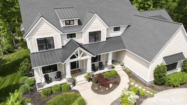 8069 Ella Terrace Ct, Rockford, MI 49341 - view of front of property with a standing seam roof, a porch, and a metal roof