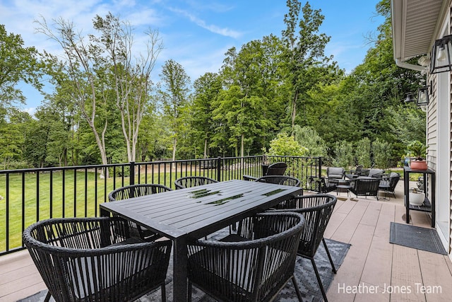 8069 Ella Terrace Ct, Rockford, MI 49341 - wooden deck with outdoor lounge area, outdoor dining space, and a yard