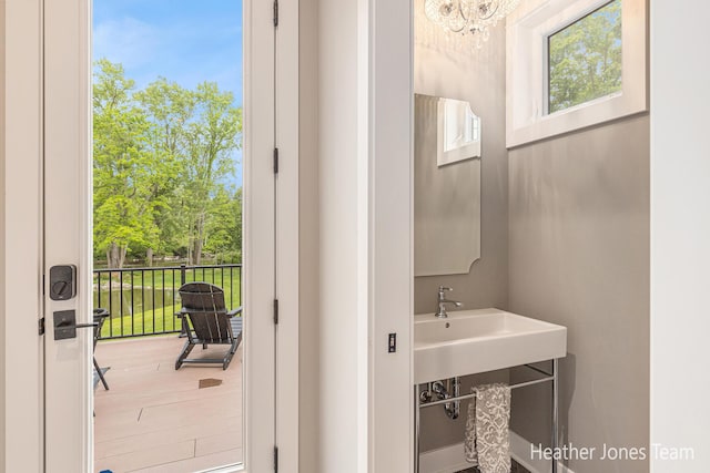 8069 Ella Terrace Ct, Rockford, MI 49341 - bathroom with a chandelier