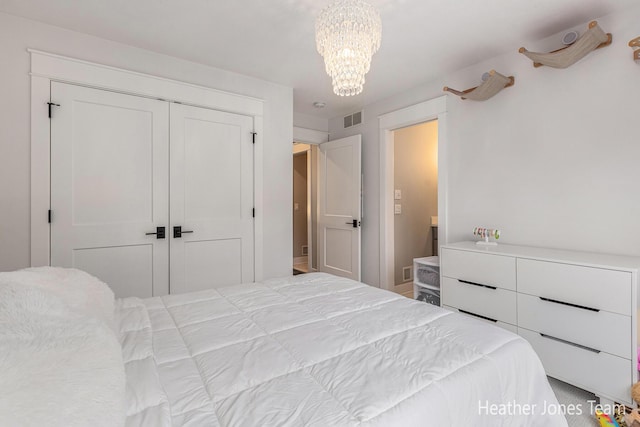 8069 Ella Terrace Ct, Rockford, MI 49341 - bedroom featuring a closet and a chandelier