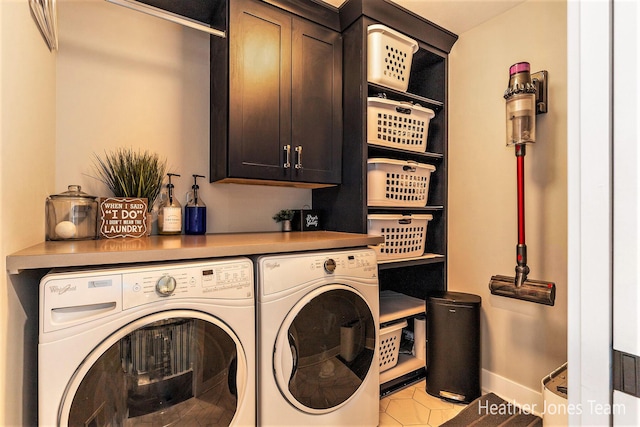 8069 Ella Terrace Ct, Rockford, MI 49341 - laundry area featuring cabinet space, independent washer and dryer, and light tile patterned floors