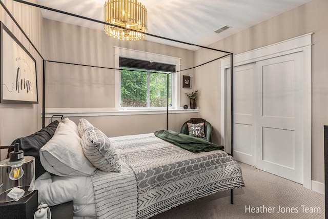 8069 Ella Terrace Ct, Rockford, MI 49341 - carpeted bedroom featuring a chandelier and a closet