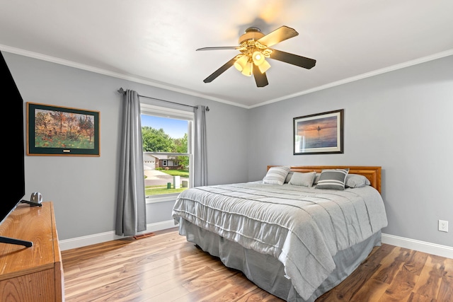 749 Foxboro Ct, Saline, MI 48176 - bedroom with light wood finished floors, crown molding, and a ceiling fan