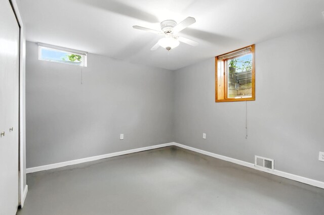749 Foxboro Ct, Saline, MI 48176 - spare room featuring concrete floors and a ceiling fan