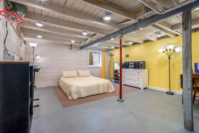 65 Salem St, Hillsdale, MI 49242 - bedroom with finished concrete floors and concrete block wall
