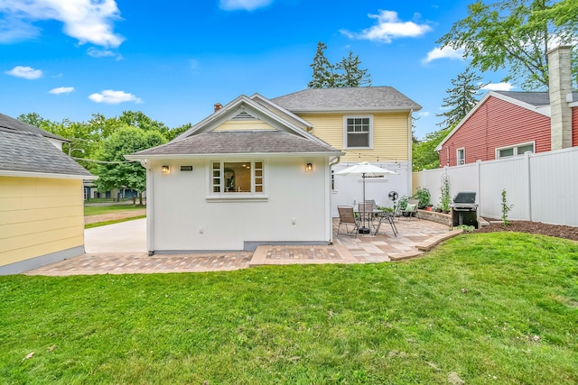 65 Salem St, Hillsdale, MI 49242 - back of property with a patio area and roof with shingles