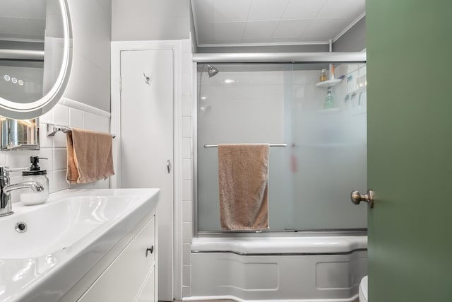 65 Salem St, Hillsdale, MI 49242 - full bathroom featuring vanity, enclosed tub / shower combo, and ornamental molding