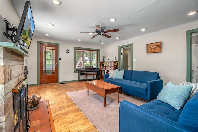 65 Salem St, Hillsdale, MI 49242 - living area featuring a fireplace, a ceiling fan, recessed lighting, and light wood finished floors