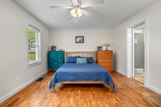 65 Salem St, Hillsdale, MI 49242 - bedroom featuring wood-type flooring, connected bathroom, and a ceiling fan