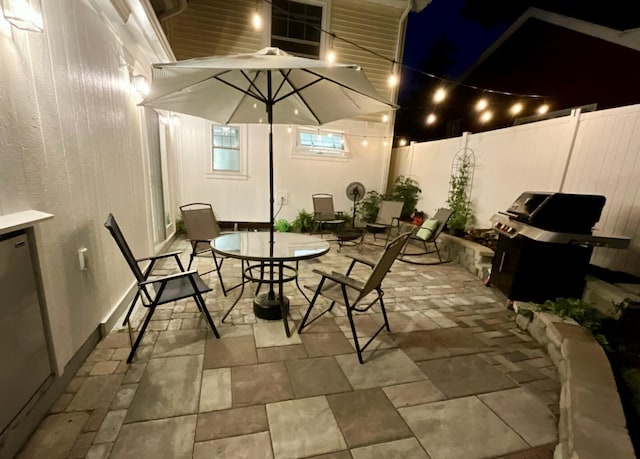 65 Salem St, Hillsdale, MI 49242 - fenced backyard with area for grilling, outdoor dining space, and a patio area