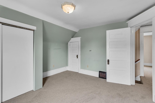 1218 Forest Ave, Jackson, MI 49201 - unfurnished bedroom with carpet floors and vaulted ceiling