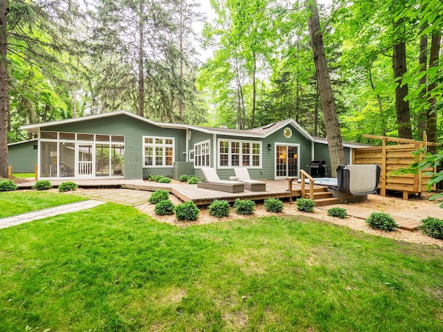 6670 Ravenswood Ave, Sawyer, MI 49125 - rear view of property with a sunroom, a wooden deck, and a yard