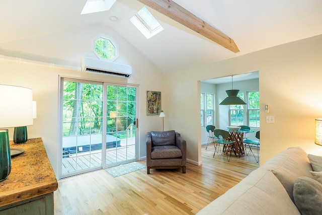 6670 Ravenswood Ave, Sawyer, MI 49125 - living room with an AC wall unit, a skylight, plenty of natural light, light wood-type flooring, and high vaulted ceiling