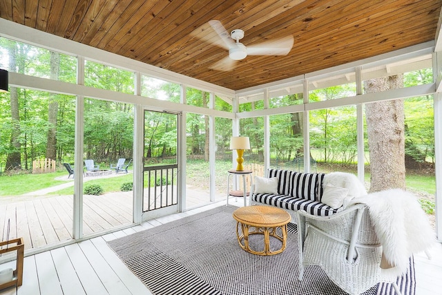 6670 Ravenswood Ave, Sawyer, MI 49125 - sunroom / solarium with ceiling fan, plenty of natural light, and an outdoor fire pit
