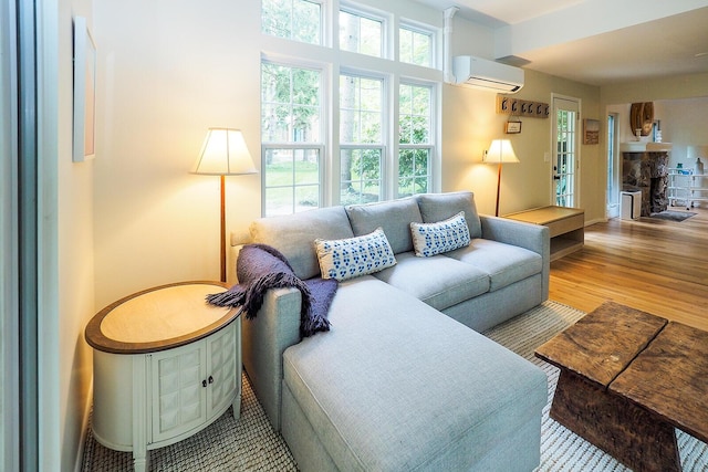 6670 Ravenswood Ave, Sawyer, MI 49125 - living room featuring a wall unit AC and wood finished floors