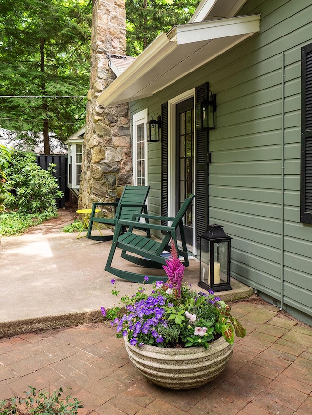 6670 Ravenswood Ave, Sawyer, MI 49125 - property entrance featuring a chimney and a patio area