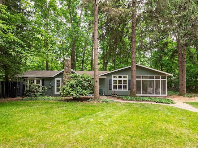 6670 Ravenswood Ave, Sawyer, MI 49125 - view of front of house featuring a sunroom and a chimney