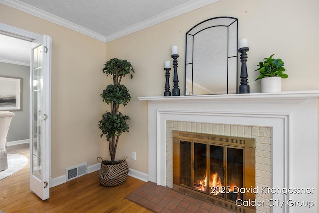 1052 Santa Cruz Dr SE, Grand Rapids, MI 49506 - detailed view of wood finished floors, a brick fireplace, and ornamental molding
