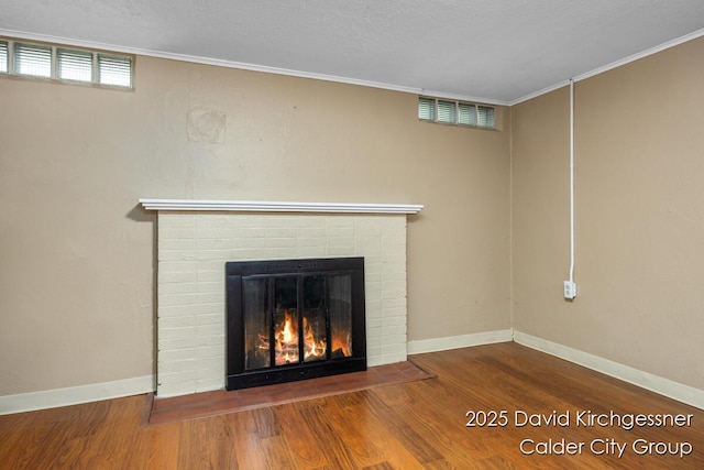 1052 Santa Cruz Dr SE, Grand Rapids, MI 49506 - detailed view of a fireplace, wood finished floors, and crown molding