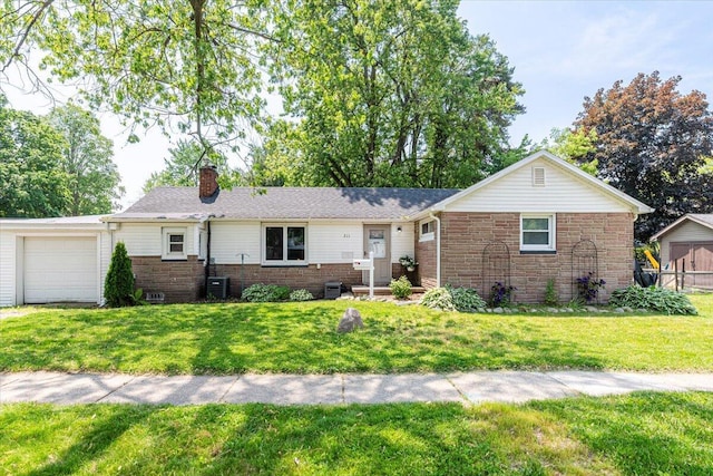 211 W S St, Grand Ledge, MI 48837 - ranch-style home featuring brick siding, a chimney, a front yard, and a garage