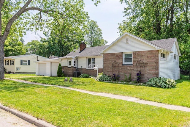 211 W S St, Grand Ledge, MI 48837 - ranch-style home with a chimney, a front yard, stone siding, an attached garage, and roof with shingles