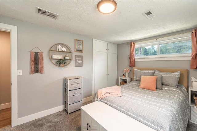 211 W S St, Grand Ledge, MI 48837 - carpeted bedroom featuring a closet and a textured ceiling