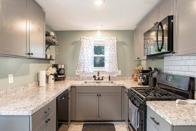 211 W S St, Grand Ledge, MI 48837 - kitchen featuring black appliances, gray cabinetry, open shelves, light countertops, and tasteful backsplash