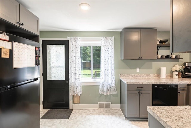 211 W S St, Grand Ledge, MI 48837 - kitchen featuring freestanding refrigerator, dishwasher, open shelves, gray cabinets, and light countertops