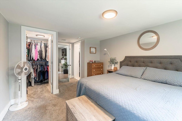 211 W S St, Grand Ledge, MI 48837 - bedroom featuring light colored carpet, a walk in closet, and a closet