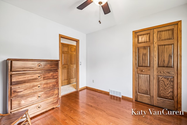 701 Novak Ln, Big Rapids, MI 49307 - unfurnished bedroom featuring wood finished floors and ceiling fan