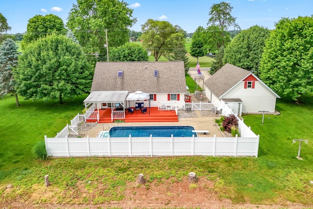 31688 Colon Rd, Colon, MI 49040 - swimming pool with a wooden deck, a fenced backyard, a diving board, and an outbuilding